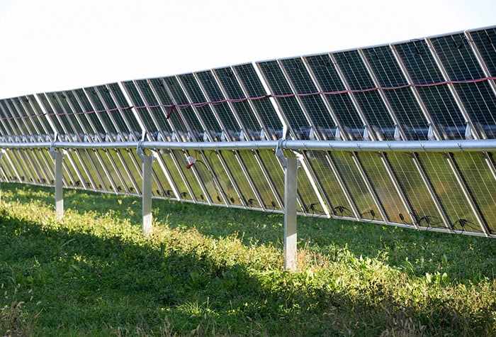 A row of solar panels from beneath